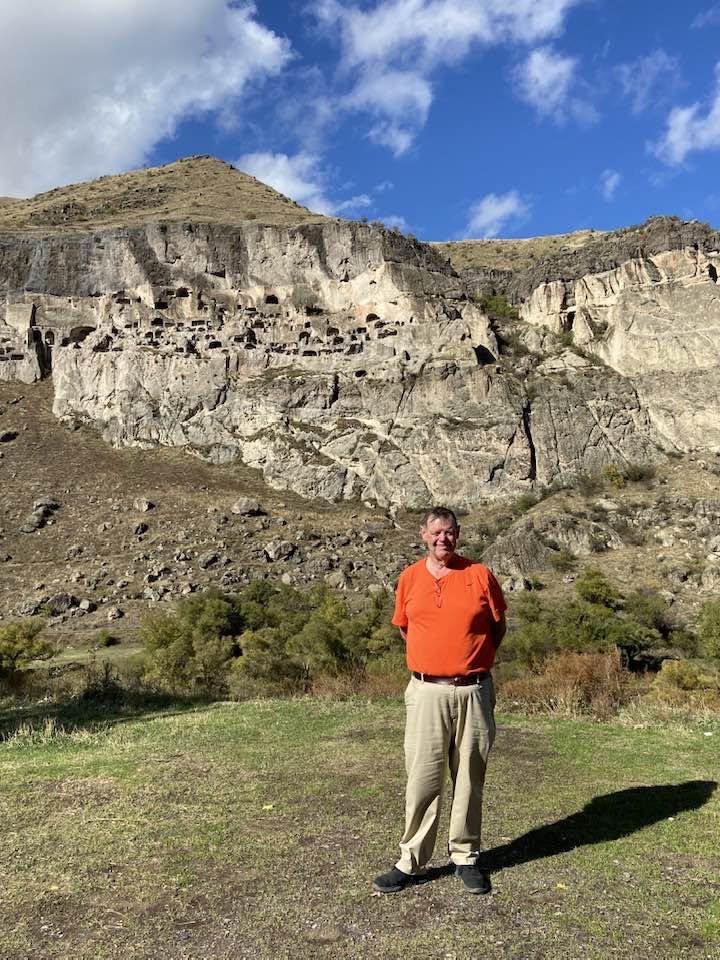 John standing in front of the cave city of Vardzia, Georgia